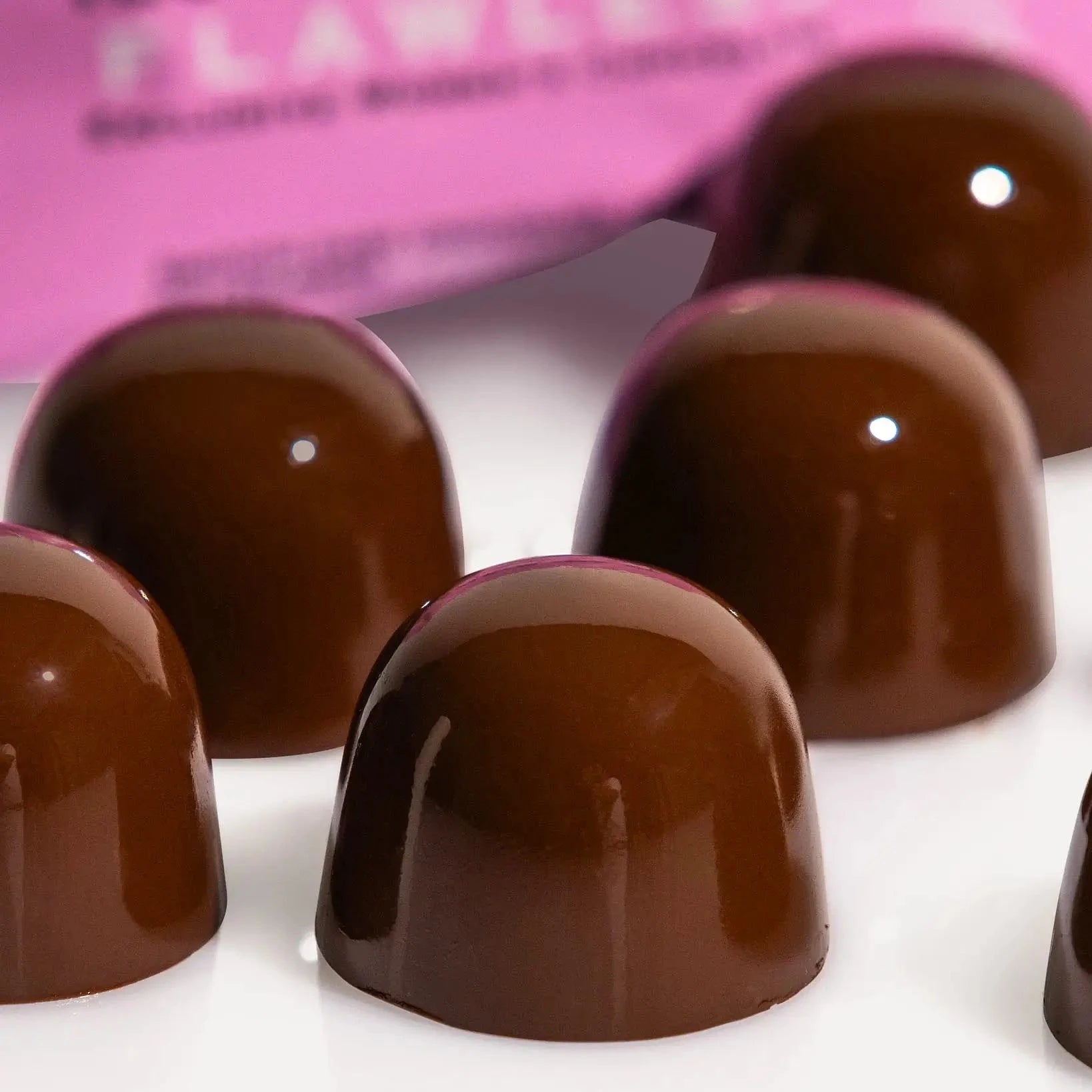 Collagen-infused dark chocolate with wild strawberries for women’s beauty benefits supporting hair skin nails and mood.