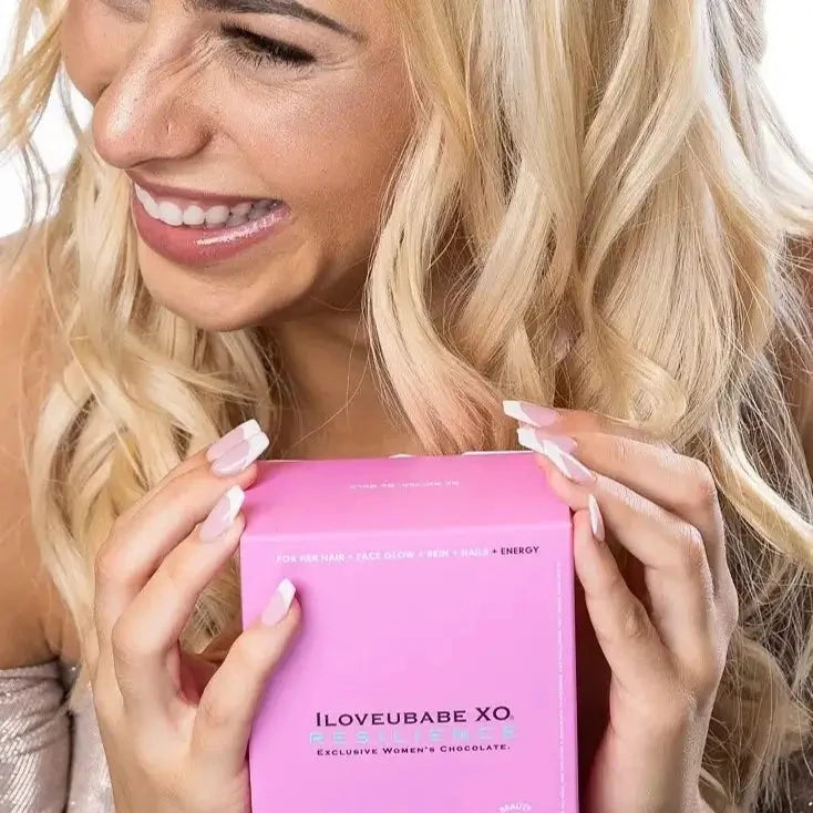 Indulge in the ILOVEUBABE XO Resilience Girlie Luxe Ten-Day Chocolate Gift Box a collection of 10 POWERPRALINES with smokey caramelized latte and ocean salts for beauty and energy.