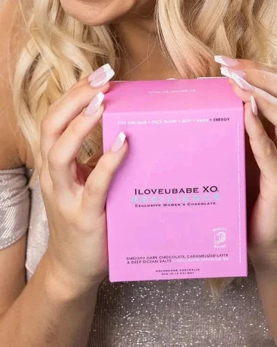 Discover the power of self-care with the ILOVEUBABE XO Resilience Girlie Luxe Ten-Day Chocolate Gift Box featuring smooth dark chocolate and collagen infusion for enhanced beauty